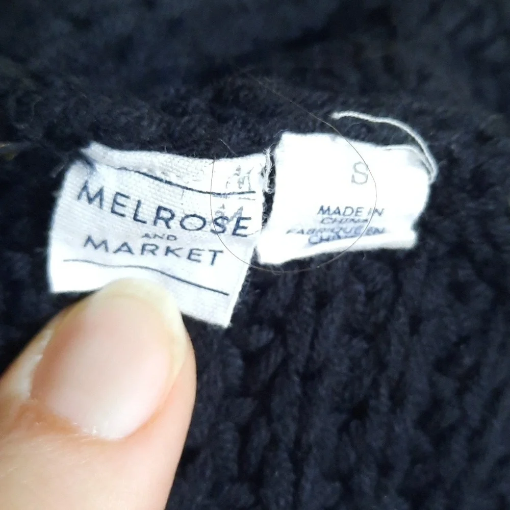 Black chunky ribbed knit crewneck sweater with back v-neck twist knot